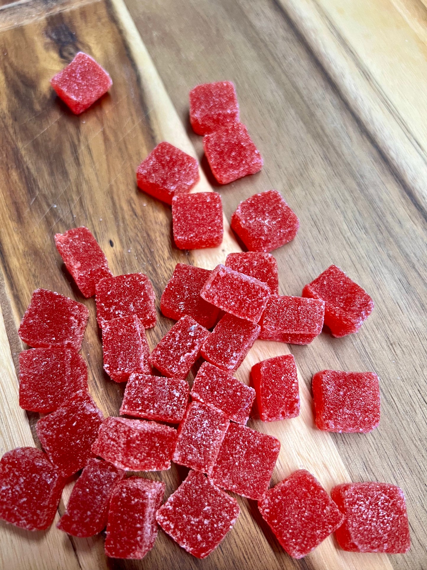 Cherry Limeade cbd gummies on wooden plank